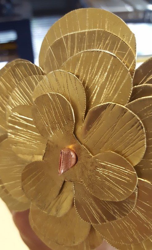 A pair of pliers were used to crimp both ends of the tube to keep the petals in place.