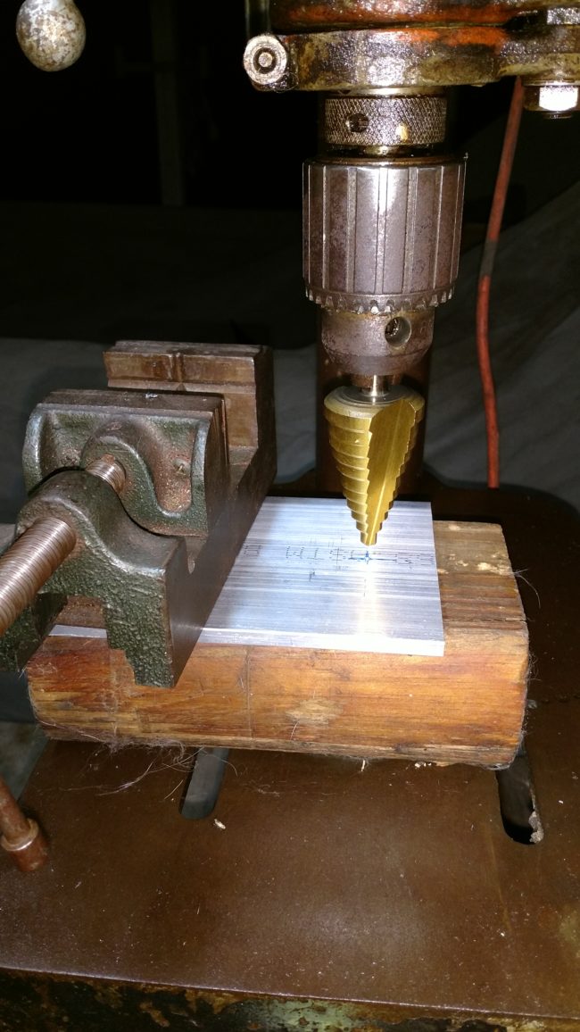 Then it was time to build a small bridge out of an aluminum plate for his phone to rest on.