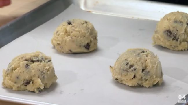 With the cookie dough whipped together, Kieffer balls up four cookies per baking sheet and places them in the freezer to help prevent her cookies from rising too much.