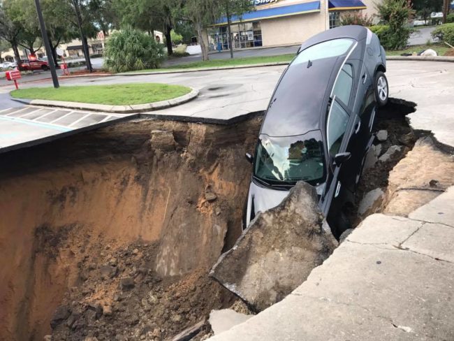 City officials say that limerock had eroded underneath the drainage system, causing the area to collapse.