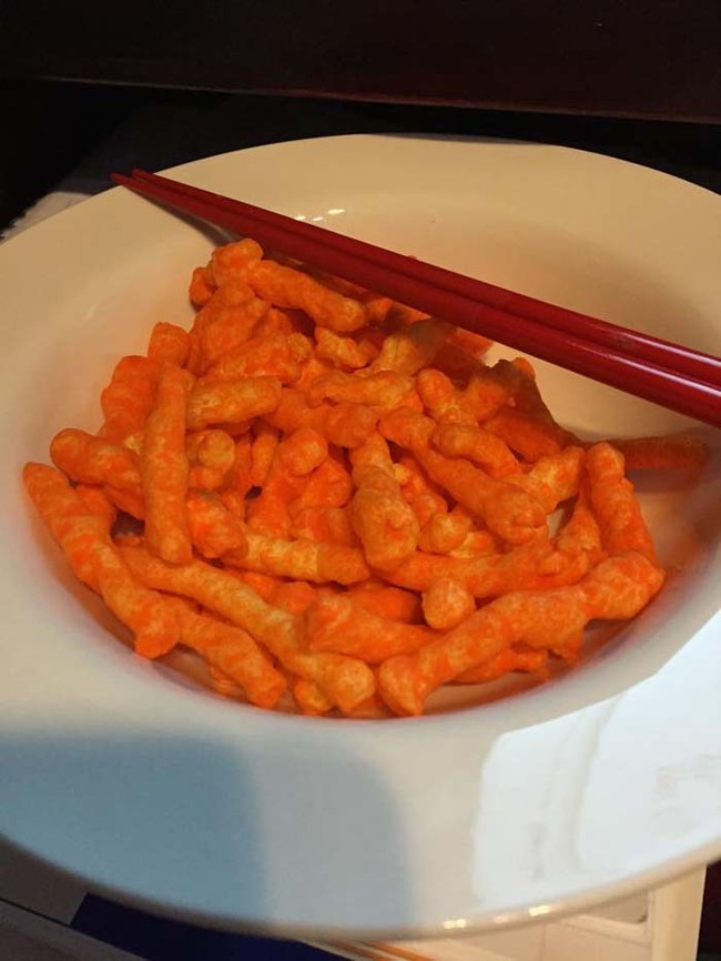 If you must eat cheesy snacks by your computer, do it with chopsticks. You won't get your fingers or keyboard dirty.