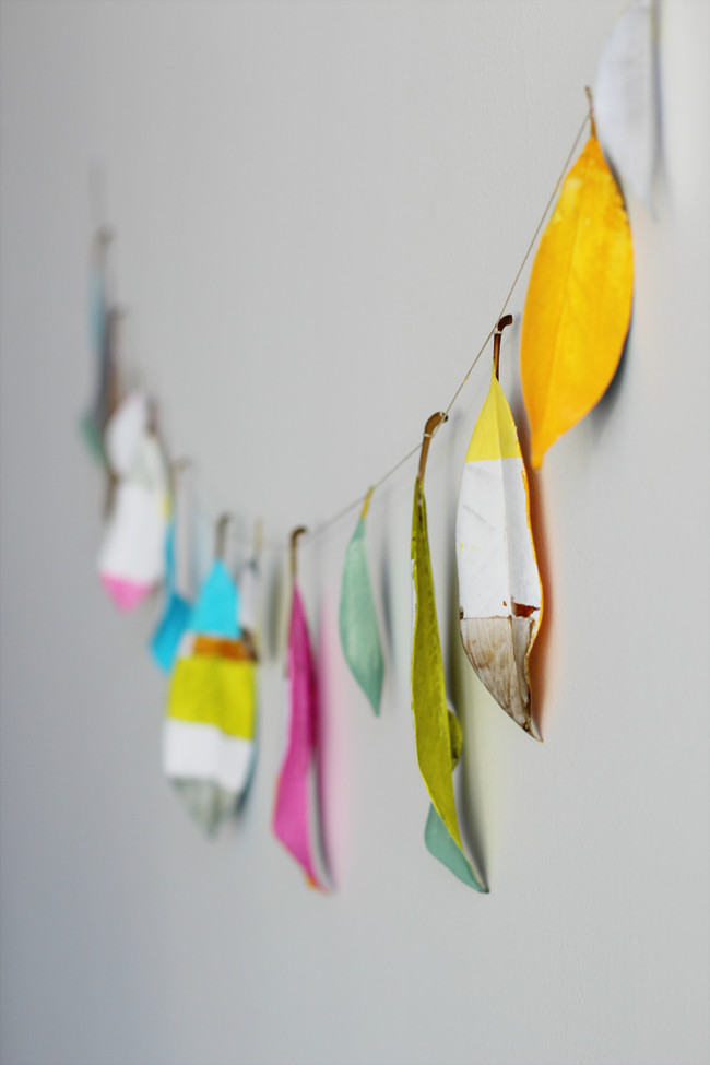 Do something a little different and paint your leaves bright hues. Then, you can hang them in any room.