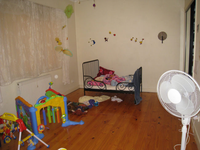 Heartbreakingly, they found the child in a dark room behind a door that was chained shut. When they brought her into the light, they found that she was covered in bruises.