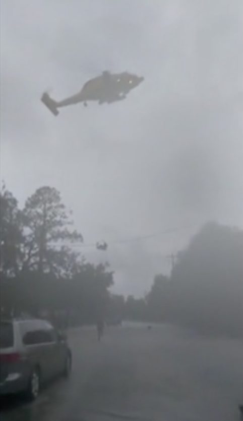 The first helicopter that came by was only taking the elderly, so despite Tyler's 103-degree fever, they still had to wait. Undeterred, she called the Coast Guard again and was ultimately rescued.