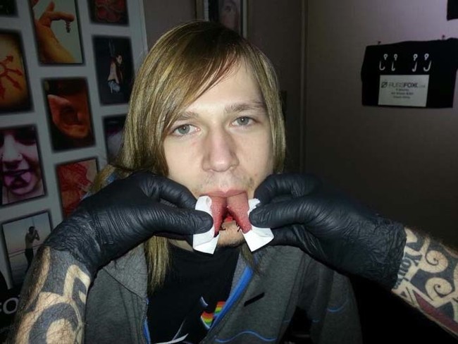 This guy just had his tongue split in a process known as "bifurcation."